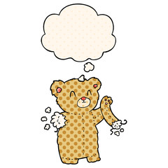 cartoon teddy bear with torn arm and thought bubble in comic book style