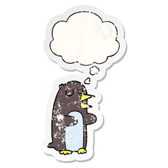 cartoon penguin and thought bubble as a distressed worn sticker