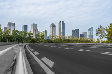 Fototapeta na wymiar empty asphalt road on modern bridge with city skyline background.