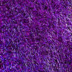 Purple abstract background. Purple grass texture. Texture of purple fur. Artificial color fur. Fur in the interior.  Vegan fur. Protection of animals.