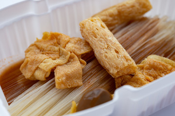 raw instant noodles with beancurd close up