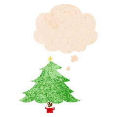 cartoon christmas tree and thought bubble in retro textured style