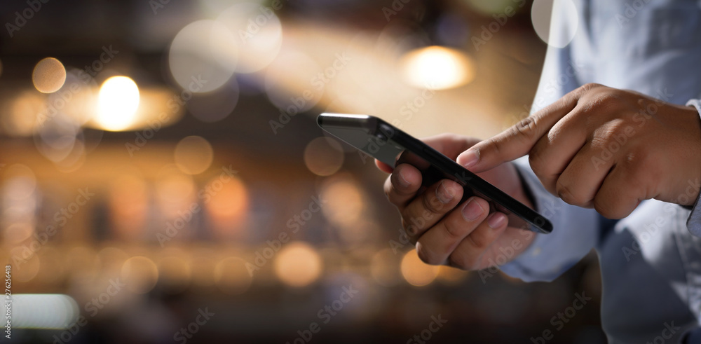 Aufkleber man holding en hands and using digital tablet mobile phone telephone with blank copy space scree