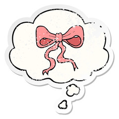 cartoon bow and thought bubble as a distressed worn sticker