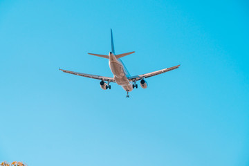 San Diego, USA, 2018. Airliner in blue sky. Travel, air transportation concept