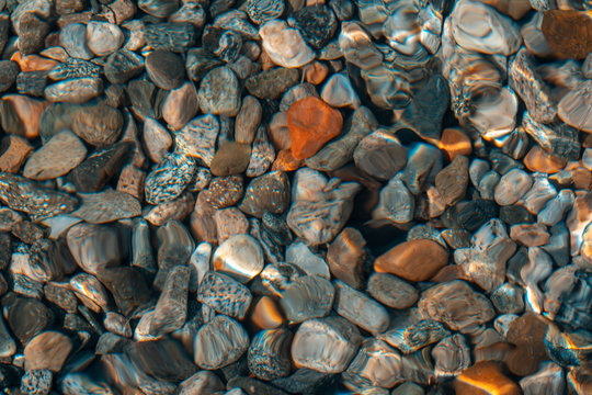 Colorful stones under water. Can be used as background