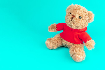 Teddy brown doll bear isolated on blue background, mock up for card celebration