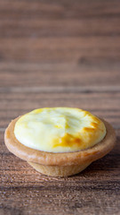 Cheese baked tart on wooden background