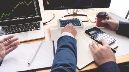 Business Team Investment Entrepreneur Trading discussing and analysis data the stock market charts and graphs negotiation and research budget, teamwork traders