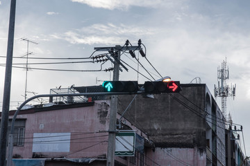 Traffic light with red and green light on the sky.