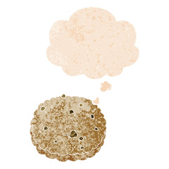 cartoon biscuit and thought bubble in retro textured style