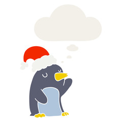 cute cartoon christmas penguin and thought bubble in retro style