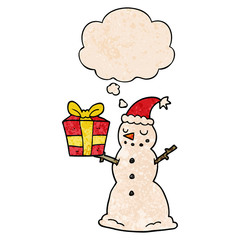 cartoon snowman with present and thought bubble in grunge texture pattern style