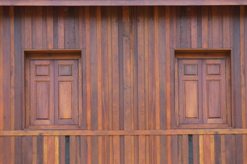 Obraz na płótnie Canvas Walls and windows of wooden houses background.