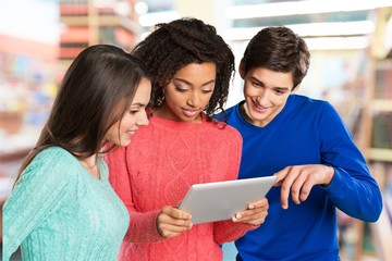 Group of Students with computer at lesson in classroom