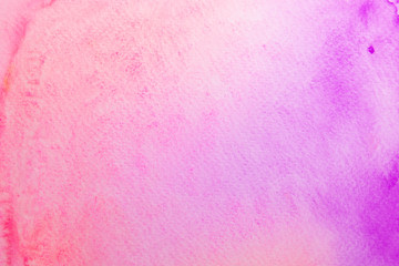 Abstract pink and violet watercolor on paper. The color splashing in the paper. It is a hand drawn.