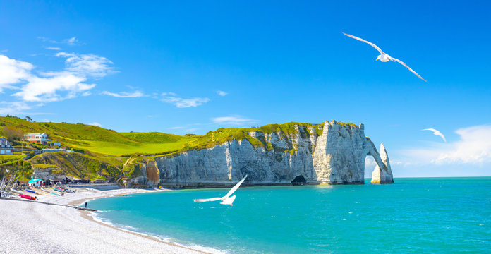 Picturesque panoramic landscape on the cliffs of Etretat. Natural amazing cliffs. Etretat, Normandy, France, La Manche or English Channel. Coast of the Pays de Caux area in sunny summer day. France