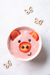 Strawberry smoothie look like a pig for kids breakfast