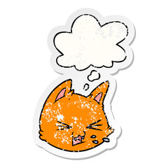 spitting cartoon cat face and thought bubble as a distressed worn sticker
