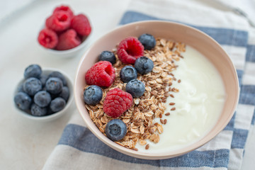 Granola with yogurt and berries for healthy breakfast