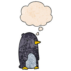 cartoon penguin and thought bubble in grunge texture pattern style