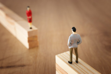 concept image of gender gap, A man and a woman look at each other from a distance