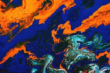 Fluid art painting abstract texture, blue, white, orange, black and turquoise. Color paint mix.
