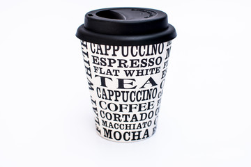 Reusable coffee take-away cup made with renewable bamboo pulp with different hot drink varieties name written on a white background
