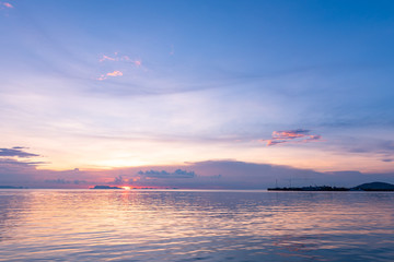 Fototapeta premium Panoramic tropical purple sky blue sea sunset with golden light background ,Koh samui pier Thailand