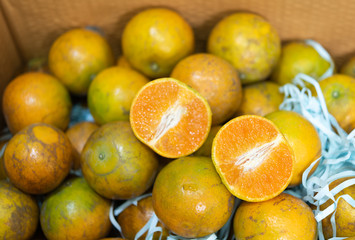 Orange fruits pack in paper box background