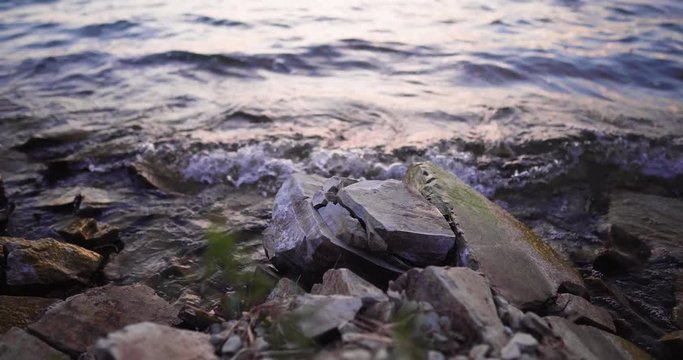 Lake Cachuma, California, USA timelapse of Waves Gently Wash Up Onto rocky shore