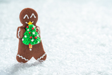 Funny Gingerbread cookie men with tiny marzipan snowman