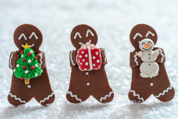Funny Gingerbread cookie men with tiny marzipan snowman