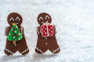 Funny Gingerbread cookie men with tiny marzipan snowman