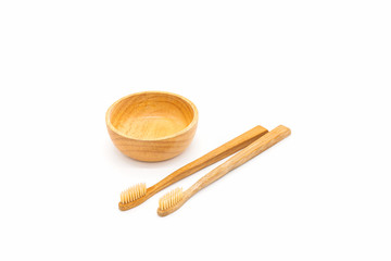 Bamboo toothbrush on white background.