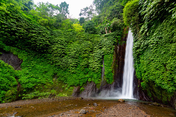 Naklejka na ściany i meble Munduk waterfall in Bali, Indonesia