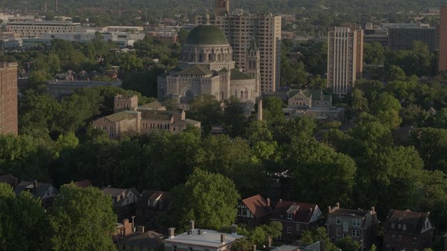Aerial view of the Cathedral Basilica in St. Louis with a tilt down over historic homes