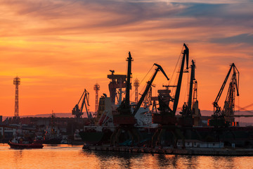 Fototapeta na wymiar Varna port at sunset under dramatic cloudy sky