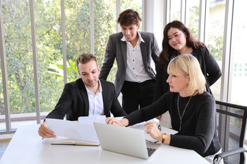Multiethnic business people discussing company about new house project in meeting room with smiling and happy faces