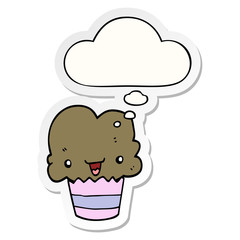 cartoon cupcake with face and thought bubble as a printed sticker
