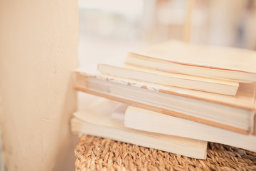 close up books stacking on table in room and warm light
