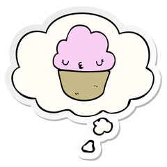 cartoon cupcake with face and thought bubble as a printed sticker