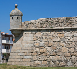 Wall and turret of historic old stone fort in Povoa de Varzim, Porto district, Portugal, built in 1701. Exterior. © Barry