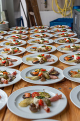 plates with antipasti appetizers
