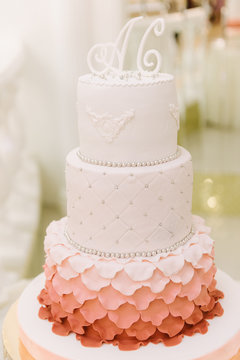 Big wedding cake close-up on the wedding table close up