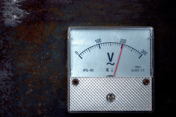 Vintage old analog volt meter scale of measurement device