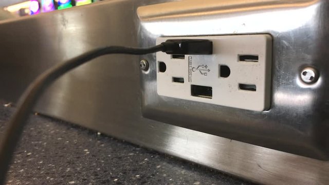 Plugging and unplugging into usb port at airport