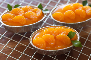 Homemade orange cake on wooden vintage table background