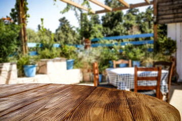 Desk of free space and summer blurred background of garden 