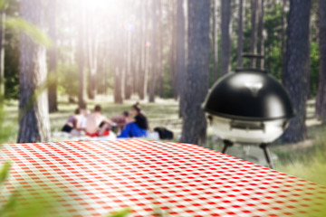 Desk of free space and summer blurred background of garden 